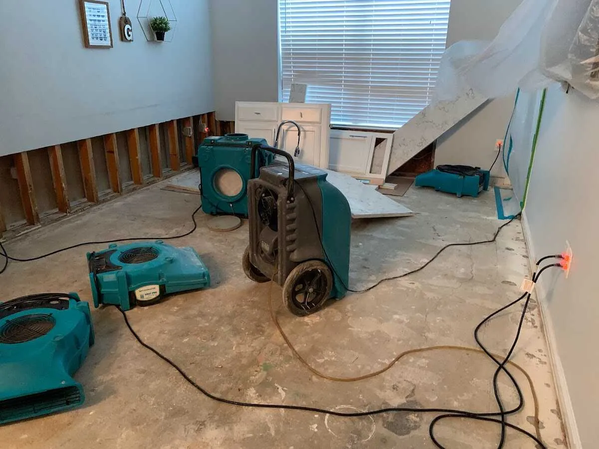 Dehumidifier in flood-cut room for Water Damage Restoration in Gonzales